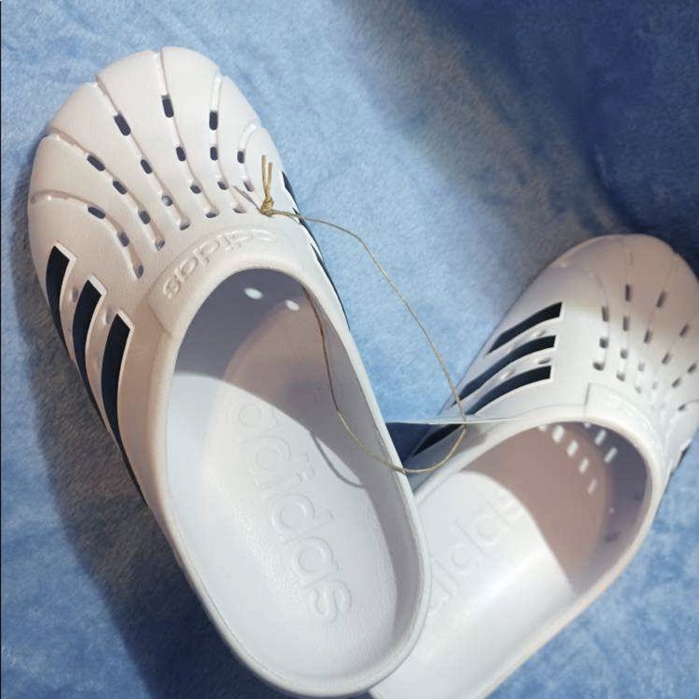 Brand new Adidas style crocs slip on‘s. Women’s size 8. Men size 7.
